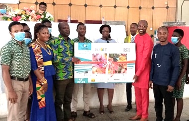 Dr Arko Akoto Ampaw (2nd from right ), Medical Director of the Eastern Regional Hospital, presenting a brand new plasma television to Peter Sakite (3rd from left), House Master of the Manya Krobo SHS. Looking on are the students and management of the hospital.
